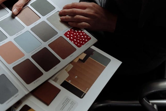 Designer's desk with pen, tablet and material sample boards